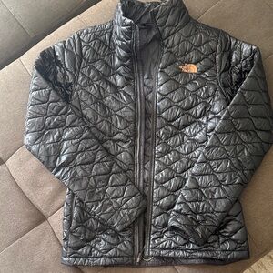 The North Face Black Quilted Jacket with Orange Logo
